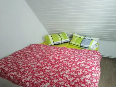 Ein Bett oder Betten in einem Zimmer der Unterkunft FeWo S.Scholz