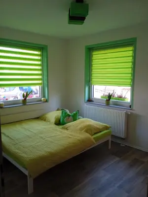 Ein Bett oder Betten in einem Zimmer der Unterkunft Ferienwohnung Apfeltraum