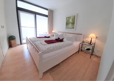 Ein Bett oder Betten in einem Zimmer der Unterkunft Waldoase I inkl Sauna-und Schwimmbadnutzung