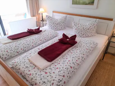 Ein Bett oder Betten in einem Zimmer der Unterkunft Waldoase I inkl Sauna-und Schwimmbadnutzung