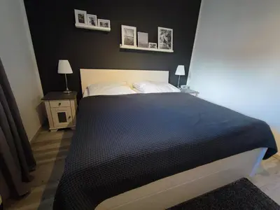 Ein Bett oder Betten in einem Zimmer der Unterkunft Harzfeuer Zentrum