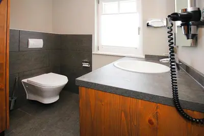 Ein Badezimmer in der Unterkunft Ferienhäuser im Torfhaus Harzresort, Torfhaus
