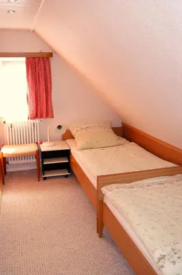 Ein Bett oder Betten in einem Zimmer der Unterkunft Gästehaus Wetzel