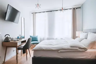 Ein Bett oder Betten in einem Zimmer der Unterkunft Boutique-Hotel Anno 1910