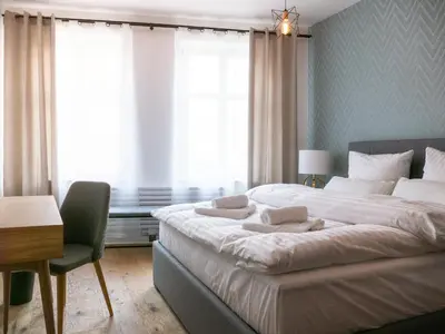 Ein Bett oder Betten in einem Zimmer der Unterkunft Boutique-Hotel Anno 1910