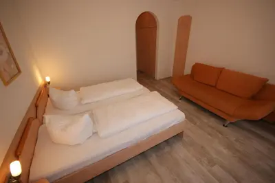 Ein Bett oder Betten in einem Zimmer der Unterkunft Hotel und Cafe Panorama