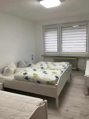 Ein Bett oder Betten in einem Zimmer der Unterkunft Am Hirschwald