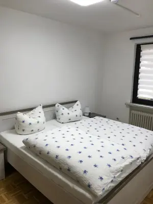 Ein Bett oder Betten in einem Zimmer der Unterkunft Am Hirschwald