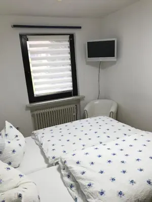Ein Bett oder Betten in einem Zimmer der Unterkunft Am Hirschwald