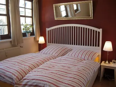Ein Bett oder Betten in einem Zimmer der Unterkunft Ferienwohnungen Marktstrasse 15