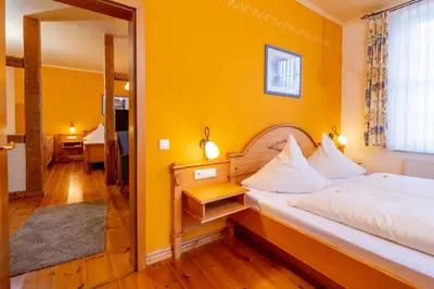 Ein Bett oder Betten in einem Zimmer der Unterkunft Harzhotel Zum Prinzen