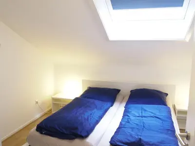 Ein Bett oder Betten in einem Zimmer der Unterkunft Ferienwohnung Bummelallee