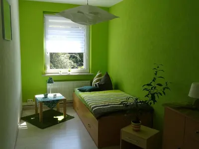 Ein Bett oder Betten in einem Zimmer der Unterkunft Ferienwohnung Kerstin