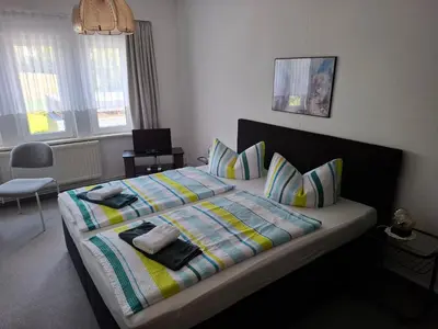 Ein Bett oder Betten in einem Zimmer der Unterkunft Pension Bodetal
