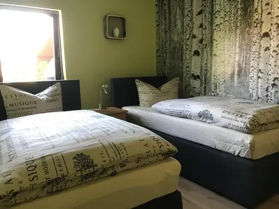 Ein Bett oder Betten in einem Zimmer der Unterkunft Ferienhaus Weinberg