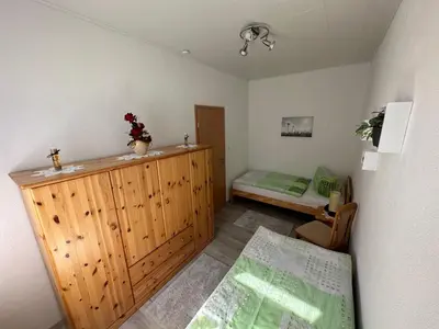 Ein Bett oder Betten in einem Zimmer der Unterkunft Ferienwohnung Hosang