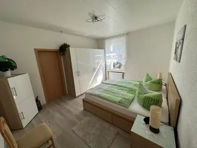 Ein Bett oder Betten in einem Zimmer der Unterkunft Ferienwohnung Hosang