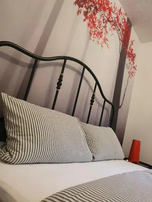 Ein Bett oder Betten in einem Zimmer der Unterkunft Luchshütte