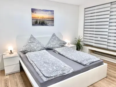 Ein Bett oder Betten in einem Zimmer der Unterkunft Ferienwohnung Wasserkunst