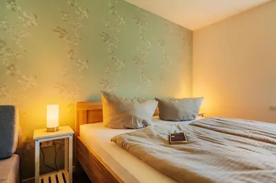 Ein Bett oder Betten in einem Zimmer der Unterkunft Villa Waldnest