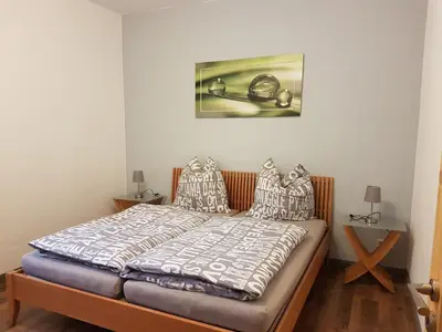 Ein Bett oder Betten in einem Zimmer der Unterkunft Ferienwohnungen Harz - Wieda