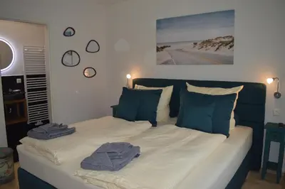 Ein Bett oder Betten in einem Zimmer der Unterkunft Gröperntorhaus
