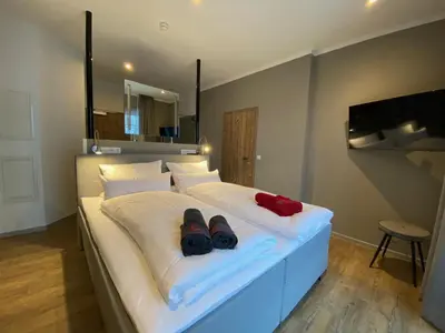 Ein Bett oder Betten in einem Zimmer der Unterkunft Braunlage Lodge