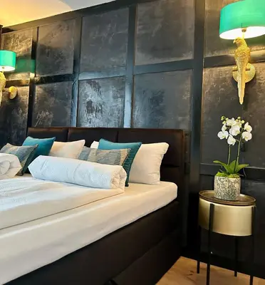 Ein Bett oder Betten in einem Zimmer der Unterkunft Die Altstadt Appartements Caprice