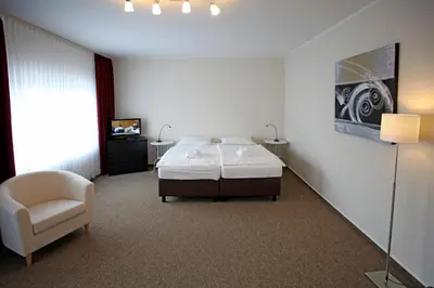 Ein Bett oder Betten in einem Zimmer der Unterkunft Appartementanlage Vierjahreszeiten