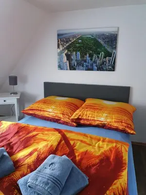 Ein Bett oder Betten in einem Zimmer der Unterkunft Eddy's Stadt Appartement