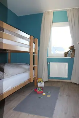 Ein Bett oder Betten in einem Zimmer der Unterkunft Ferienhaus Kleine Auszeit