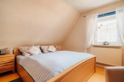 Ein Bett oder Betten in einem Zimmer der Unterkunft JermersteinSonne
