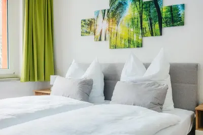 Ein Bett oder Betten in einem Zimmer der Unterkunft Bode-Apartments