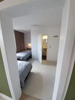 Ein Bett oder Betten in einem Zimmer der Unterkunft Haus Sonnblick - Gruppenhaus - bis zu 42 Personen - großer Gemeinschaftsbereich - Billiard - Soccer - Dart - Garten