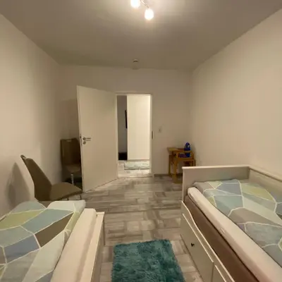 Ein Bett oder Betten in einem Zimmer der Unterkunft International 3