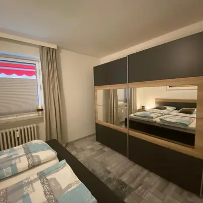 Ein Bett oder Betten in einem Zimmer der Unterkunft International 3