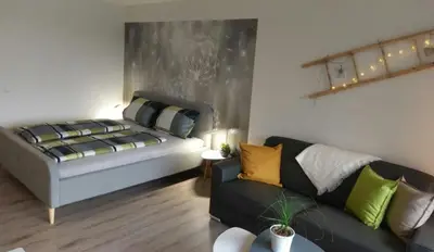 Ein Bett oder Betten in einem Zimmer der Unterkunft See Harmonie Haus 4 Jahreszeiten