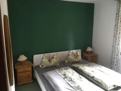 Ein Bett oder Betten in einem Zimmer der Unterkunft Ferienwohnung in Kamschlacken