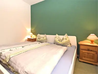 Ein Bett oder Betten in einem Zimmer der Unterkunft Ferienwohnung in Kamschlacken