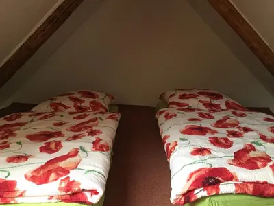 Ein Bett oder Betten in einem Zimmer der Unterkunft Schöne gemütliche Ferienwohnung mit Kamin II im Harz