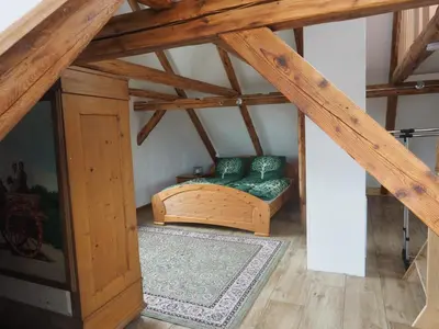 Ein Bett oder Betten in einem Zimmer der Unterkunft Schöne gemütliche Ferienwohnung mit Kamin II im Harz