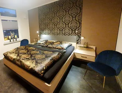 Ein Bett oder Betten in einem Zimmer der Unterkunft Ferienwohnung ODIN, FREYA & THOR