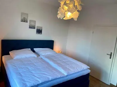 Ein Bett oder Betten in einem Zimmer der Unterkunft FeWoWa - FerienWohnungen Walter