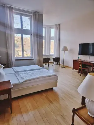 Ein Bett oder Betten in einem Zimmer der Unterkunft Hotel Villa Viktoria Luise
