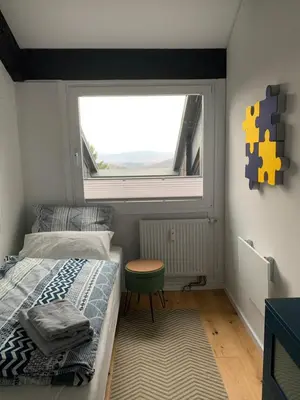 Ein Bett oder Betten in einem Zimmer der Unterkunft Ferienwohnung Mountainlook