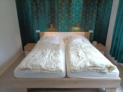Ein Bett oder Betten in einem Zimmer der Unterkunft Landhaus Dahlem