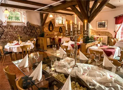 Ein Restaurant oder anderes Speiselokal in der Unterkunft Hotel Gut Voigtlaender