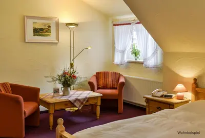 Ein Sitzbereich in der Unterkunft Hotel Gut Voigtlaender