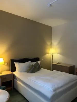 Ein Bett oder Betten in einem Zimmer der Unterkunft Hotel Am Grudenberg