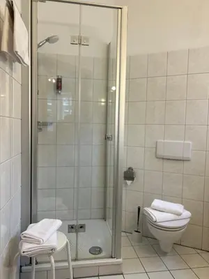 Ein Badezimmer in der Unterkunft Hotel Am Grudenberg